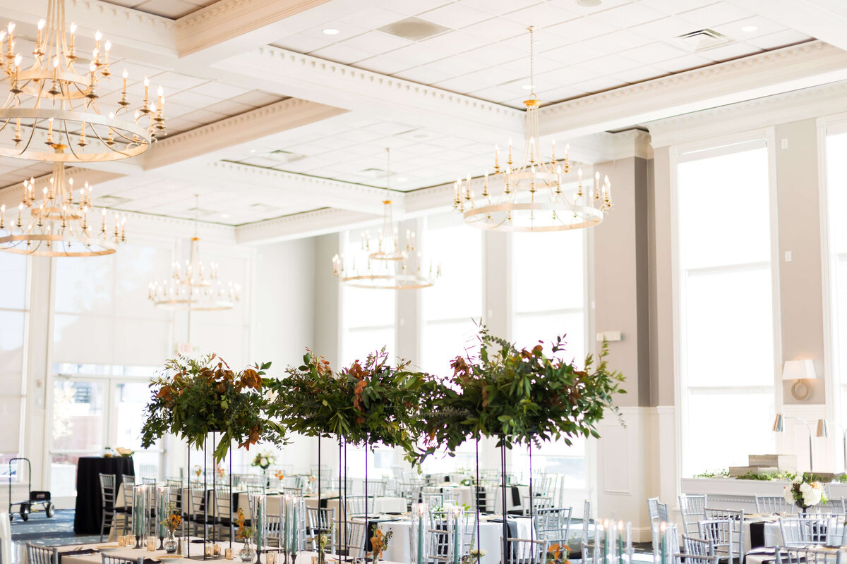 wedding reception tables with tall floral arrangements at The Carrick House Wedding venue in Lexington, KY