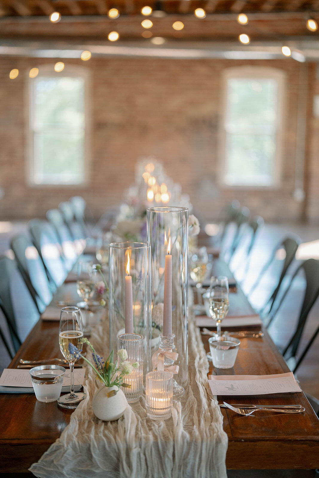 Record Box Loft wedding reception setup with floral centerpieces and long tables