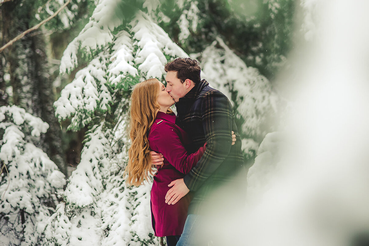couple in snowy trees
