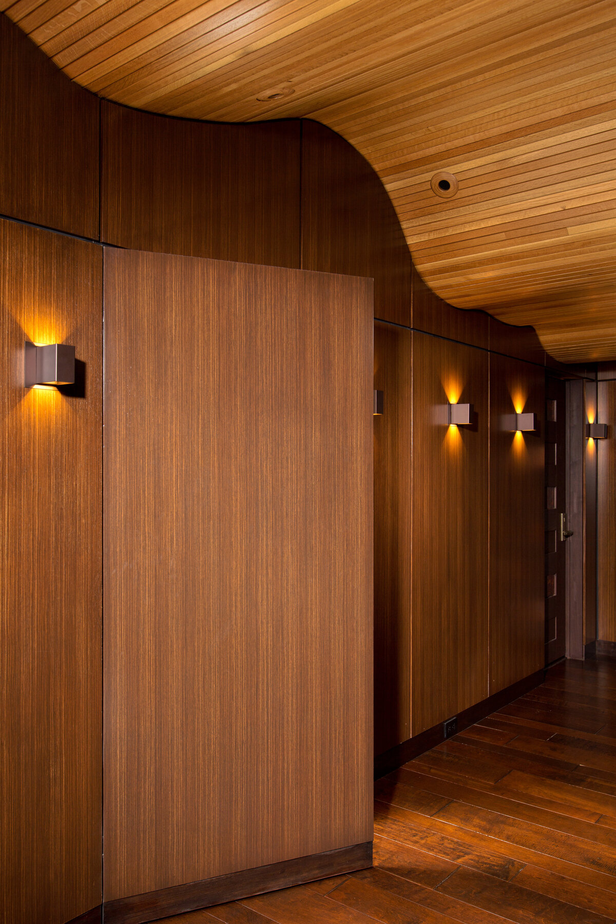 dark wood paneled hallways and door open