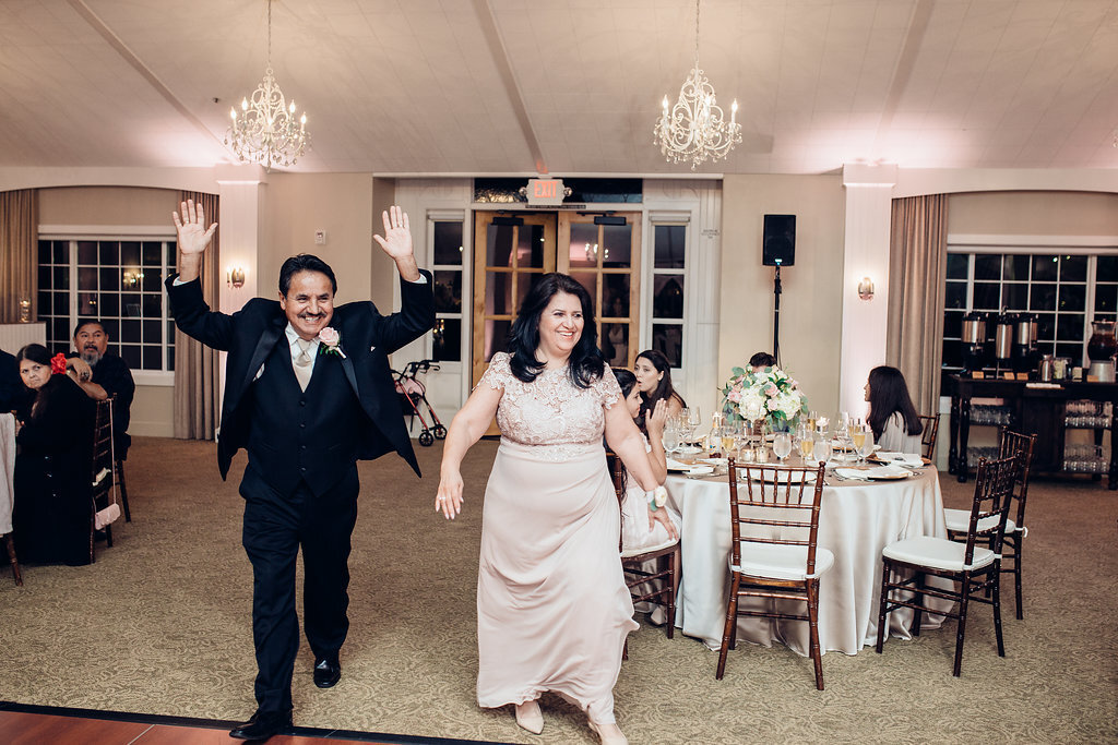 Wedding Photograph Of Man Raising His Hands And Woman  Los Angeles