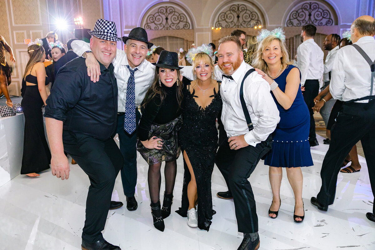 portrait of guests at the wedding reception on the dance floor at The Adolphus in Dallas