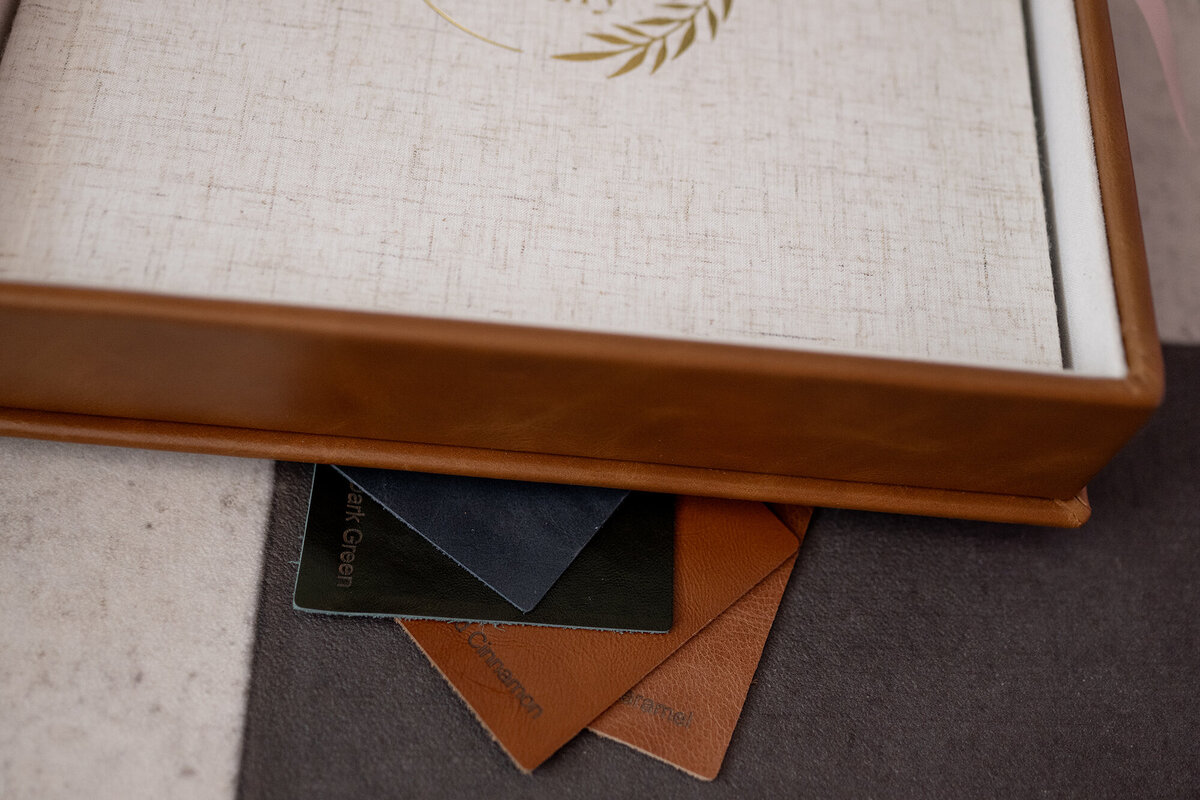 Swatches for leather albums sits under a leather album box