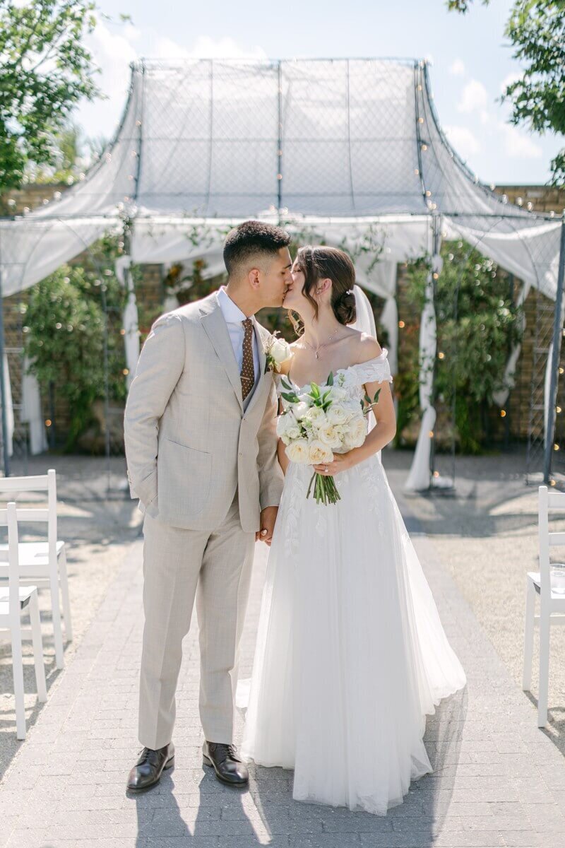 first kiss at terrain gardens wedding ceremony