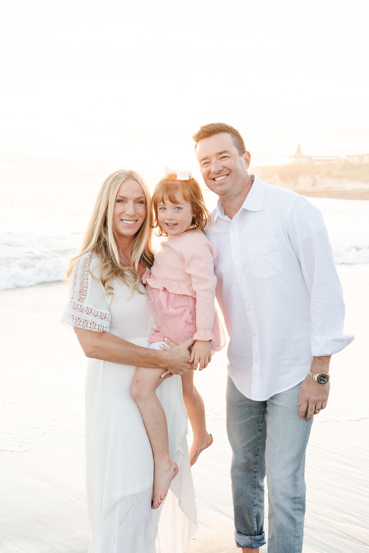 family of three at the beach during a san francisco bay area photo session