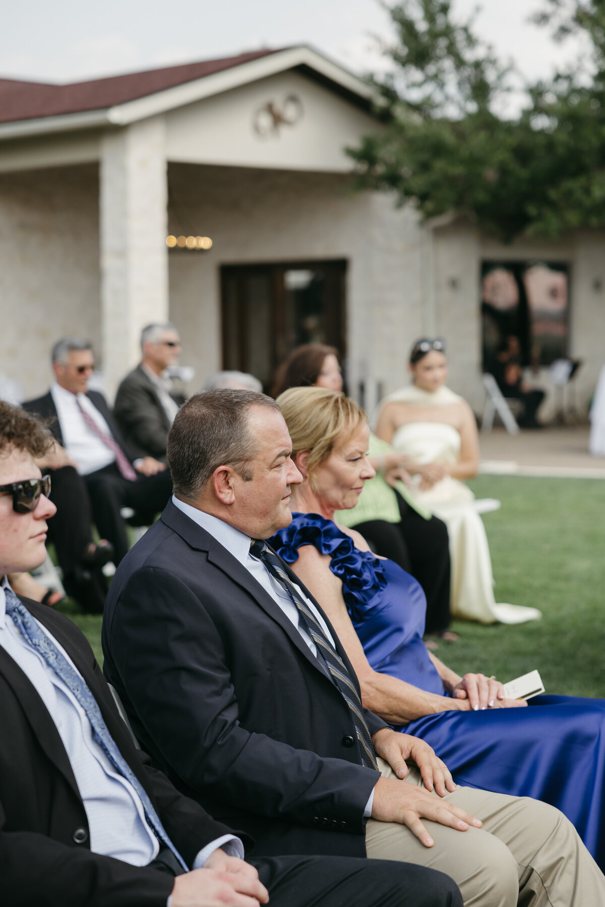ceremony guests at wedding watching bride and groom get married in austin