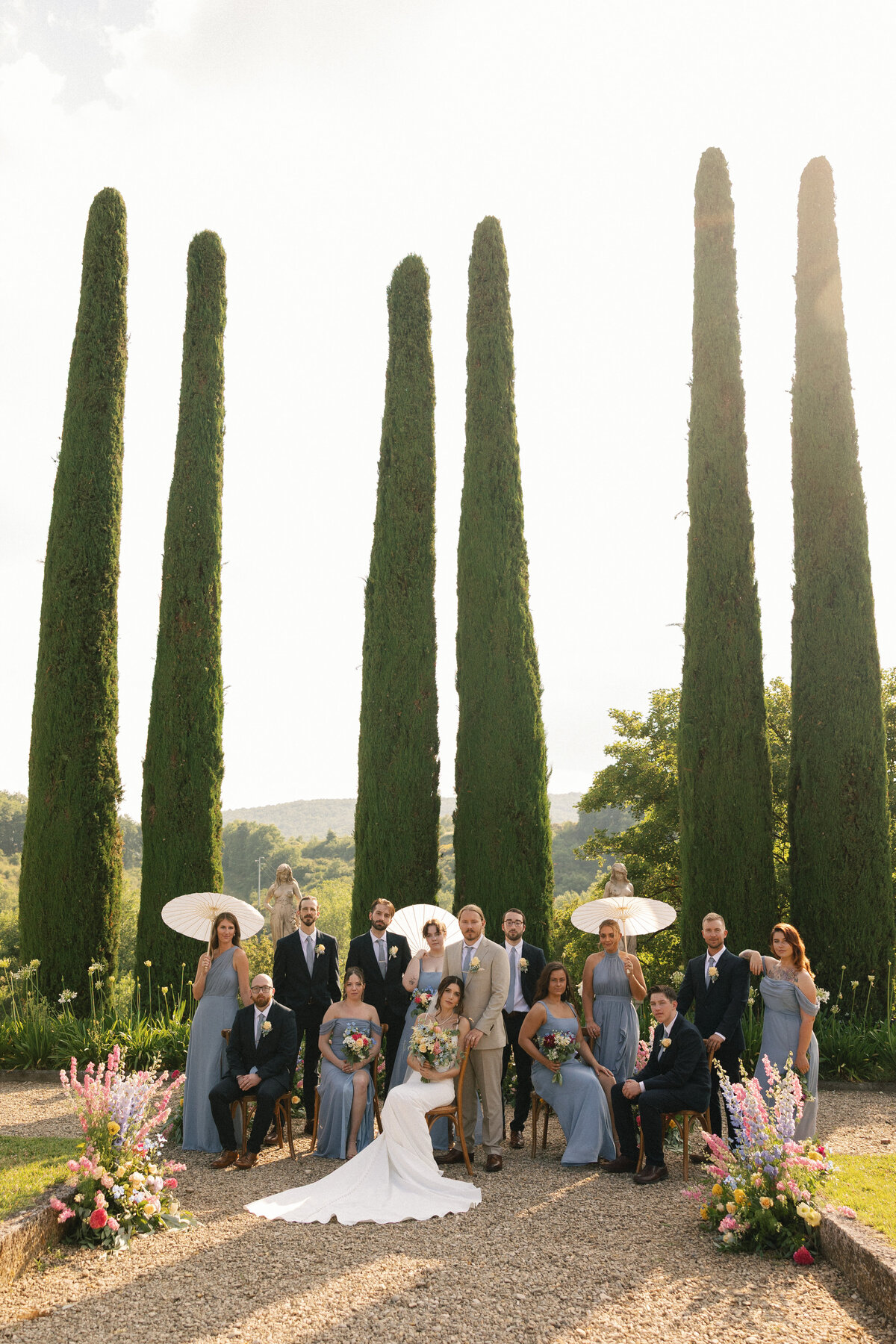 Bridal party group photo with the villa as a stunning backdrop