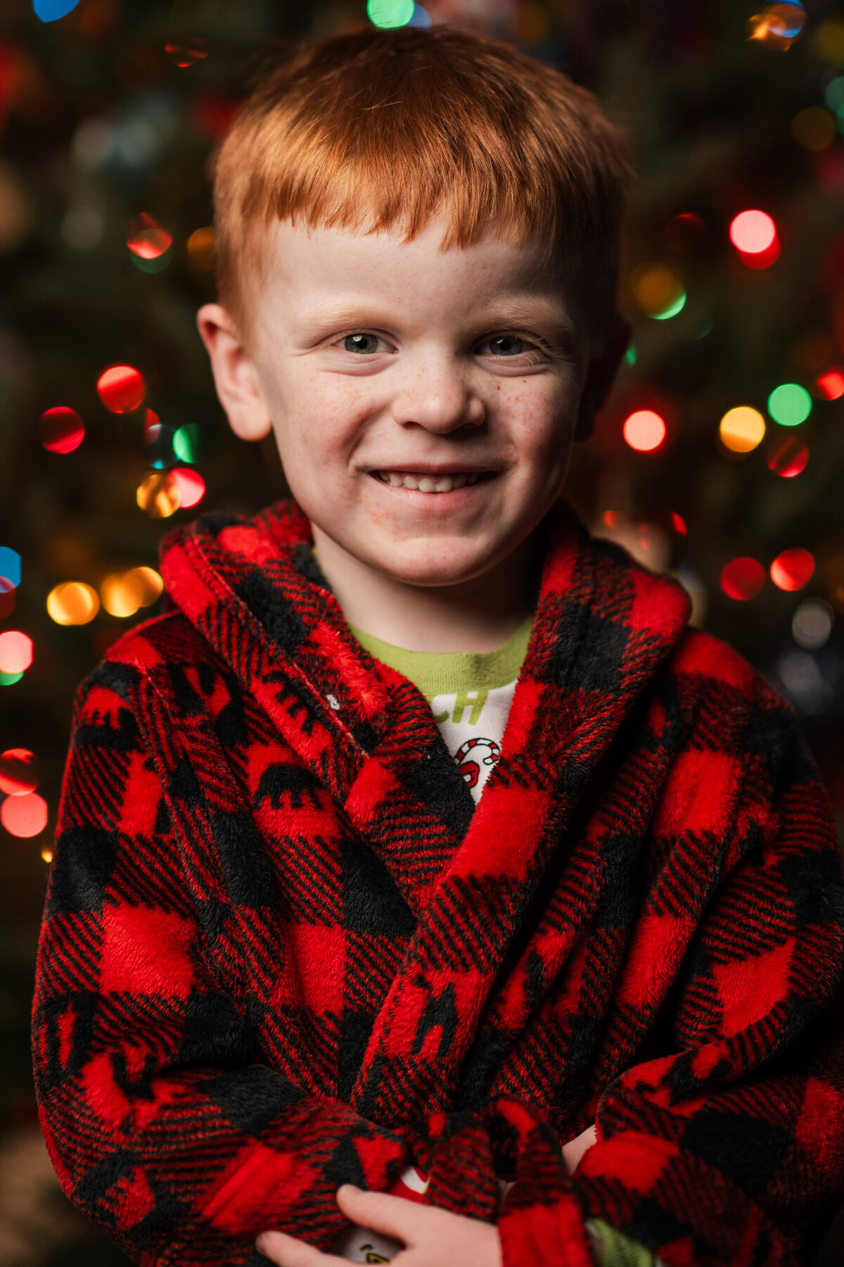 a boy poses for a Christmas photo in Chattanooga
