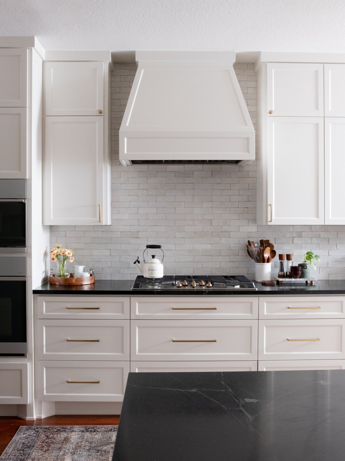 hello-home-austin-cream-kitchen-remodel-zellige-backsplash-contemporary-kitchen-subzero-refrigerator-tapered-vent-hood- soapstone-countertop-2