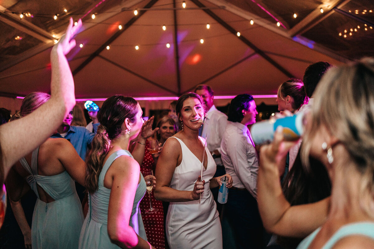 Fun dance party in luxury tented wedding at Wentworth Inn in Jackson, NH by Lisa Smith Photography