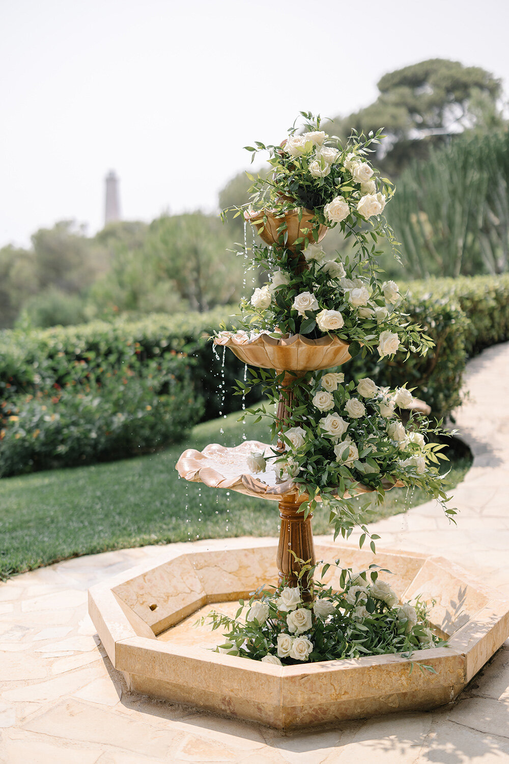 fountain with wedding flowers at grand hotel du cap ferrat