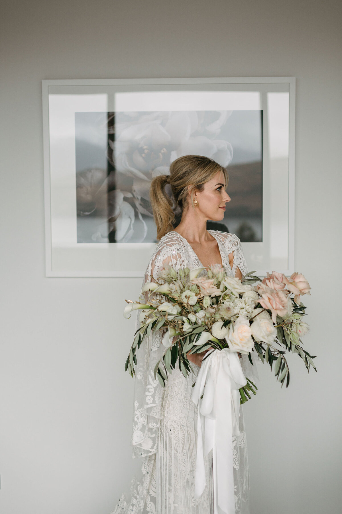 The Vase Floral Co - bride holds stunning large bouquet