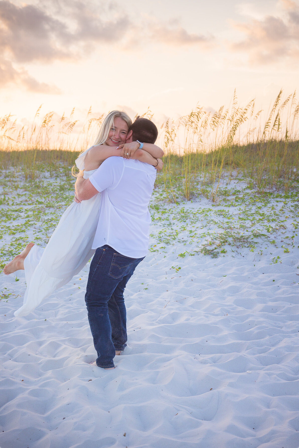 girl and guy celbrating after a proposal