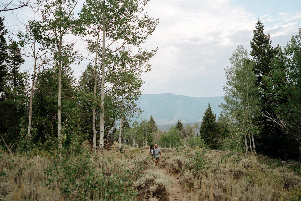 Couple during golden hour engagement shoot in Stanley, Idaho wedding/elopement - photographed by The Storytellers