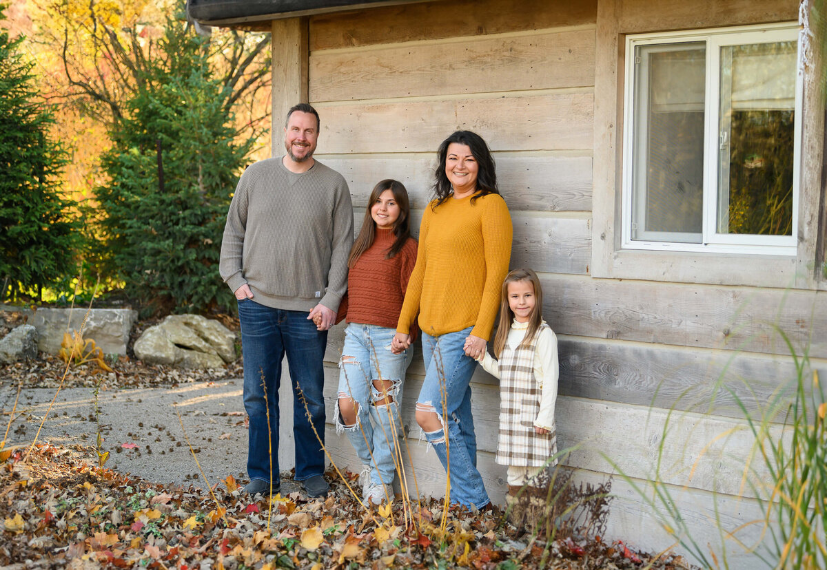 Family photo of mom and dad and two daughters for their Burlington fall family photography session