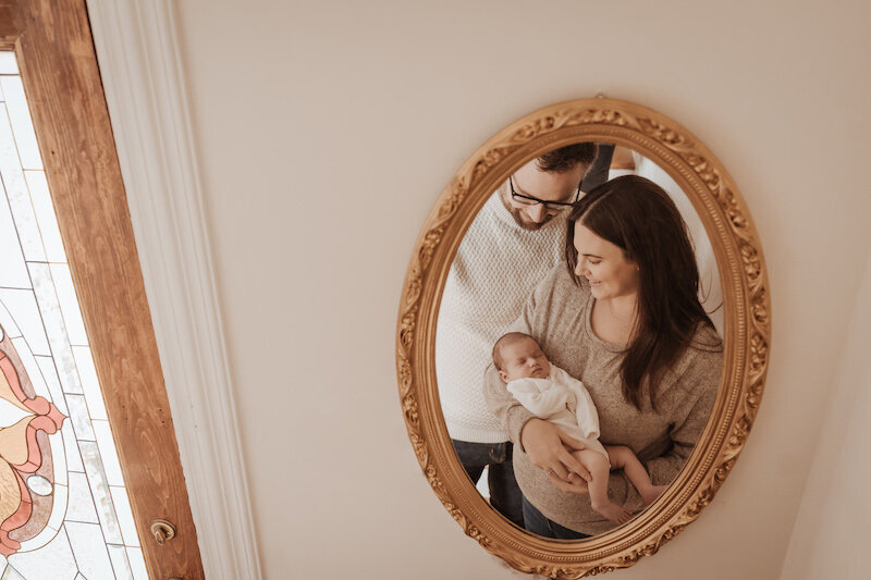 family looking in mirror