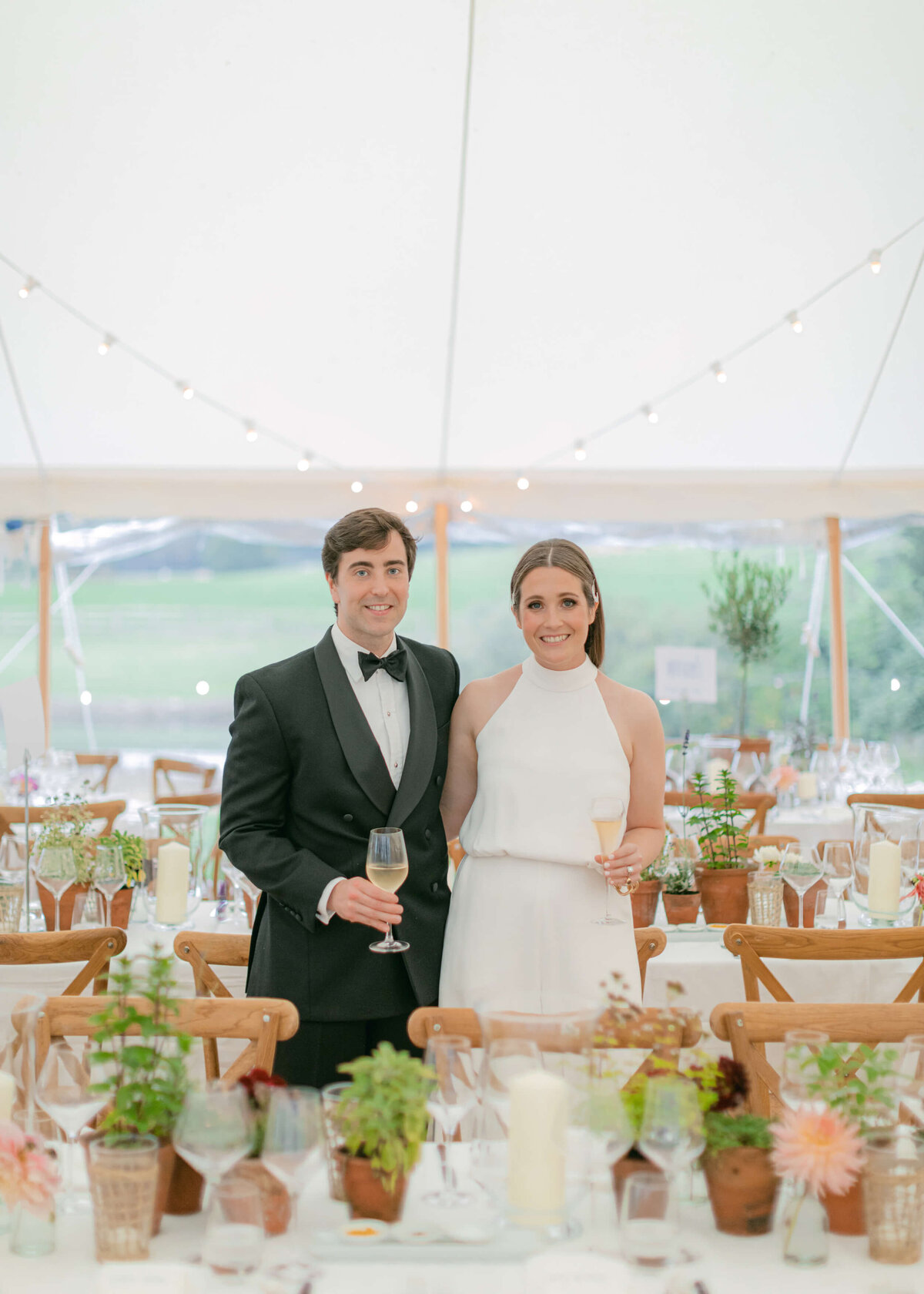 chloe-winstanley-weddings-sailcloth-tent-bride-groom-champagne