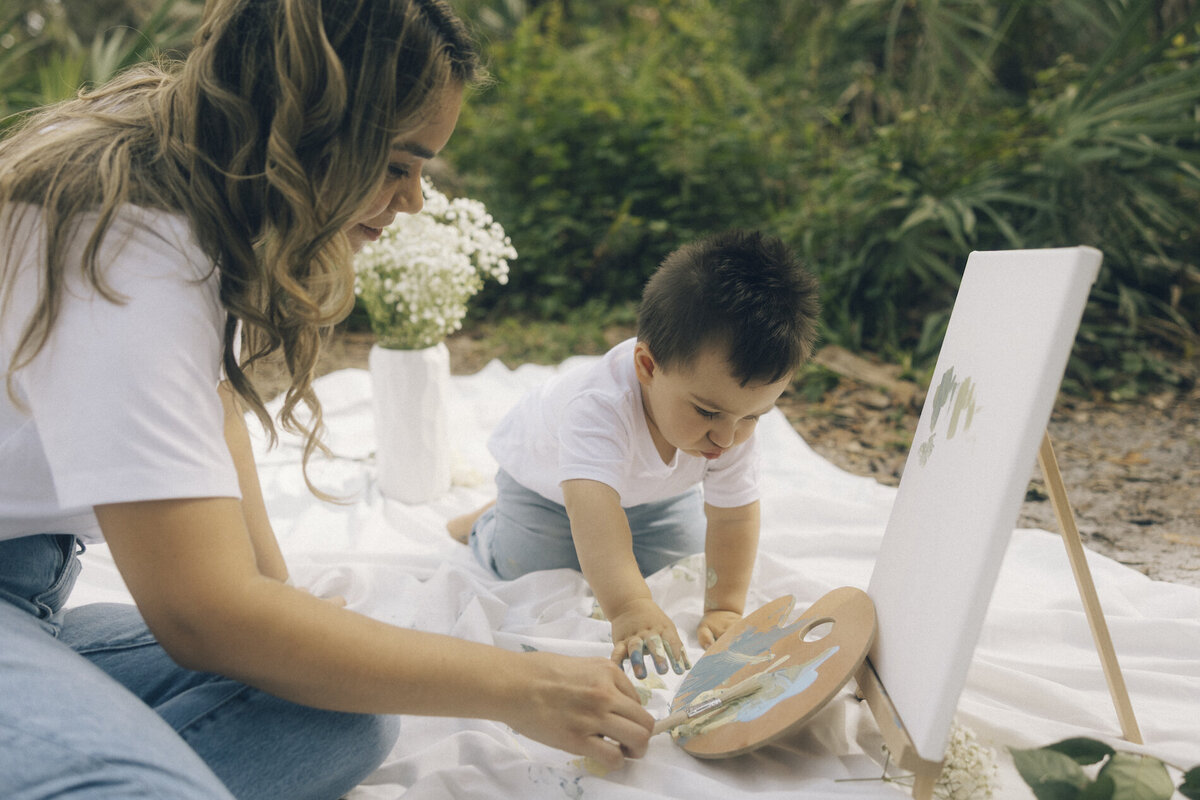 mom and son paint a picture