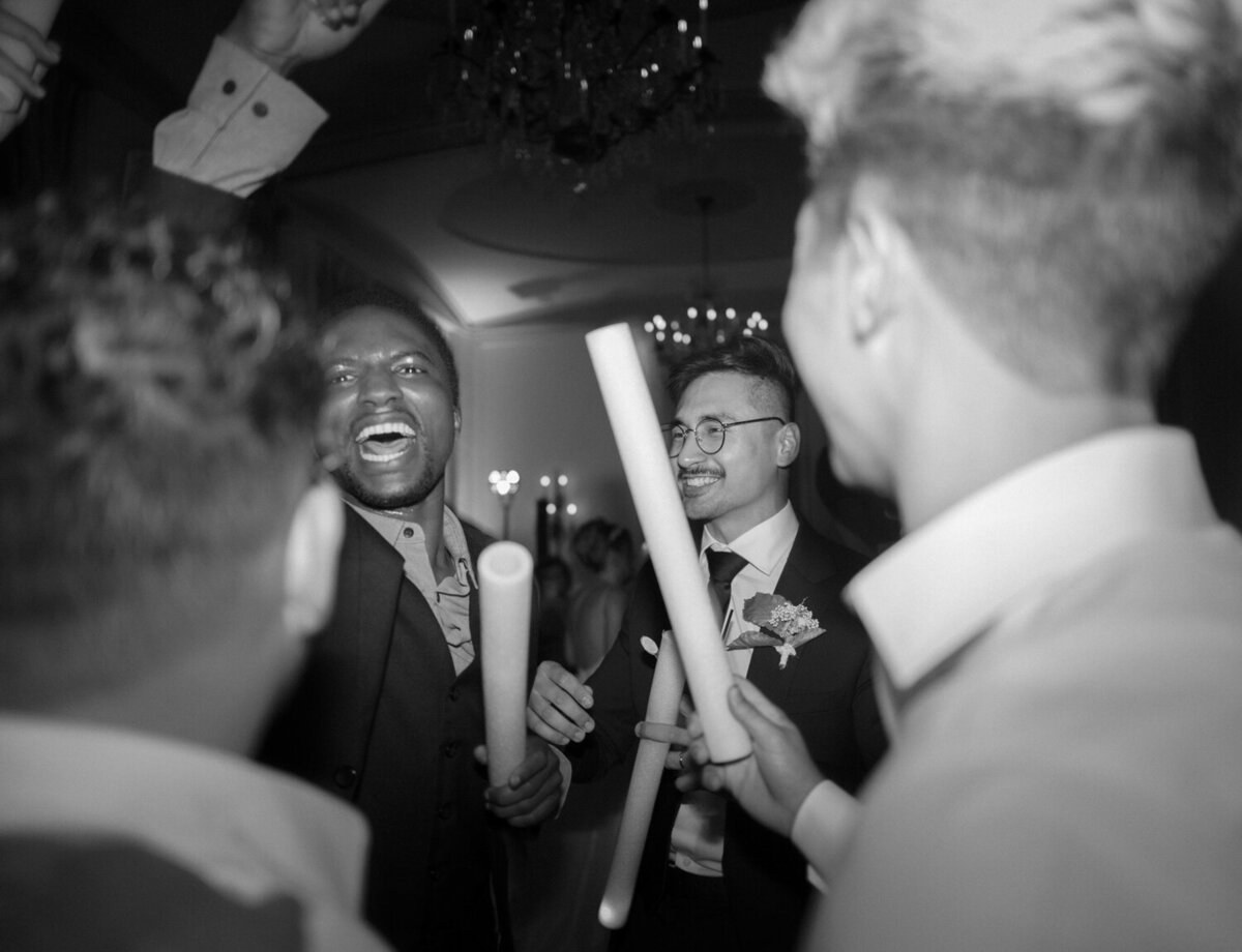 A groom dances with his friends at his Colony Club wedding reception in Michigan