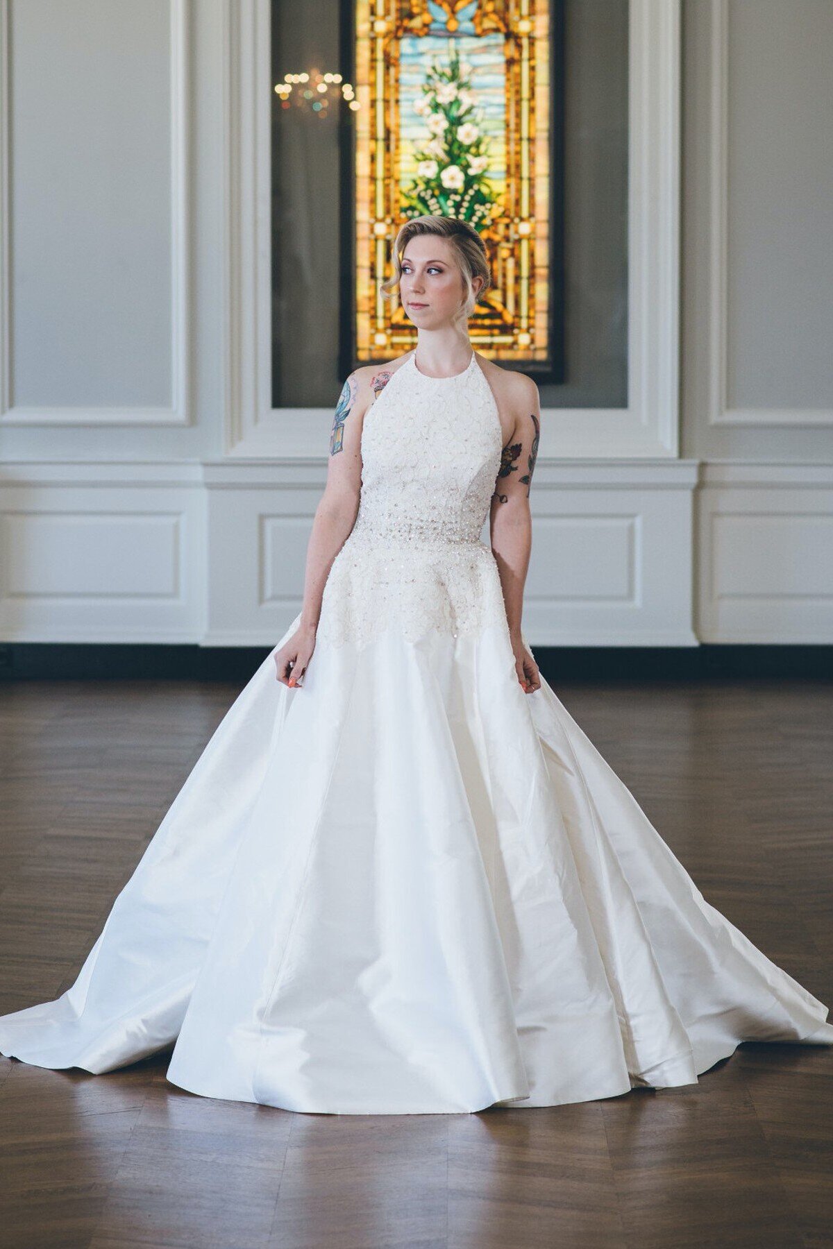 Karli is a modern ballgown wedding dress with a textured lace halter top by indie bridal designer Edith Elan.