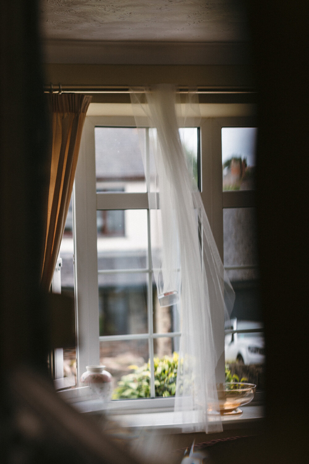 Bridal veil put onto the curtain rain and billows in the breeze