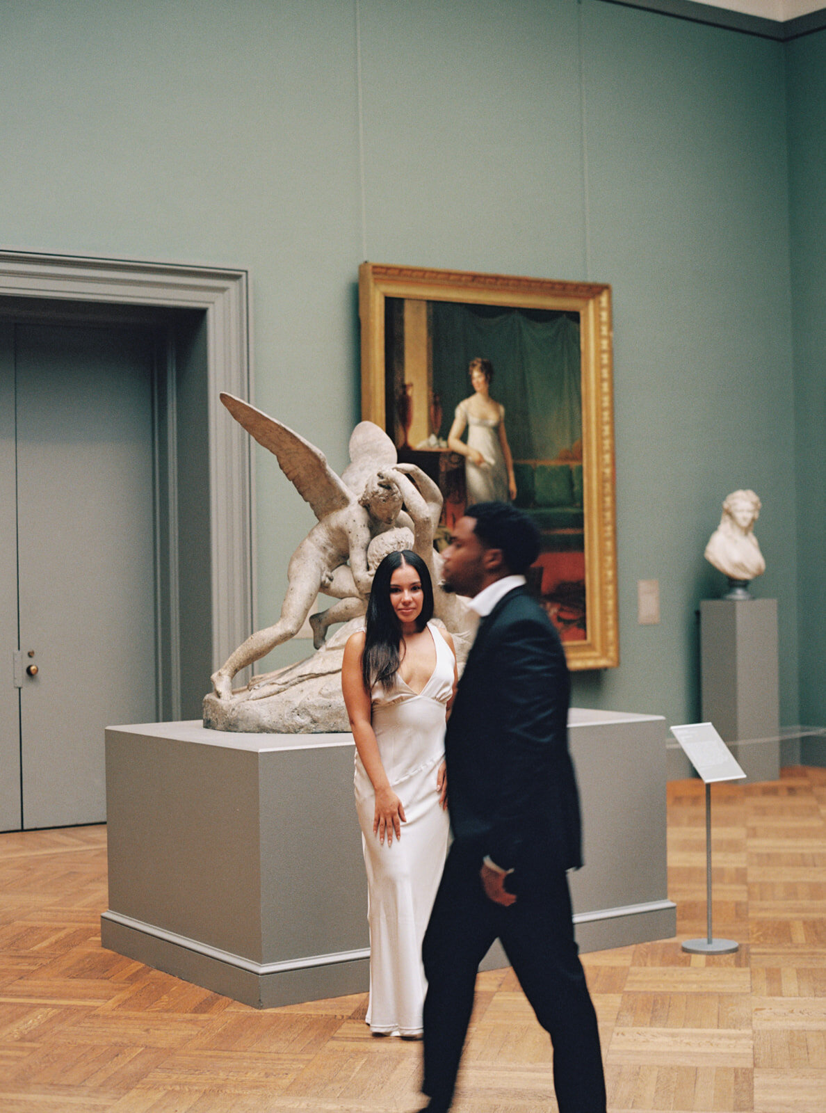 groom walks by bride and bride stairs forward, editorial style engagement session