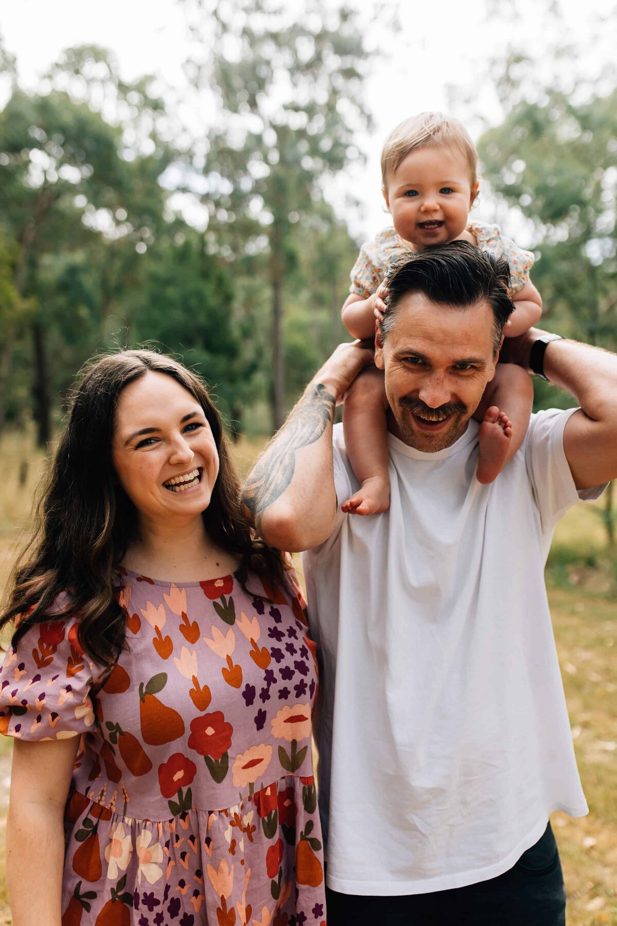 Baby sitting on Dad's shoulders, Mum standing next to them, Melbourne Photography Gift Vouchers 