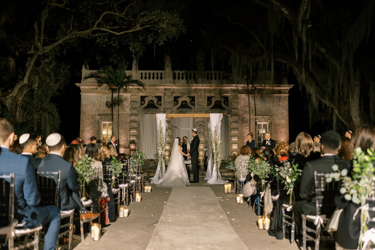 Beautiful outdoor wedding ceremony at Vizcaya gardens in Miami, Florida.