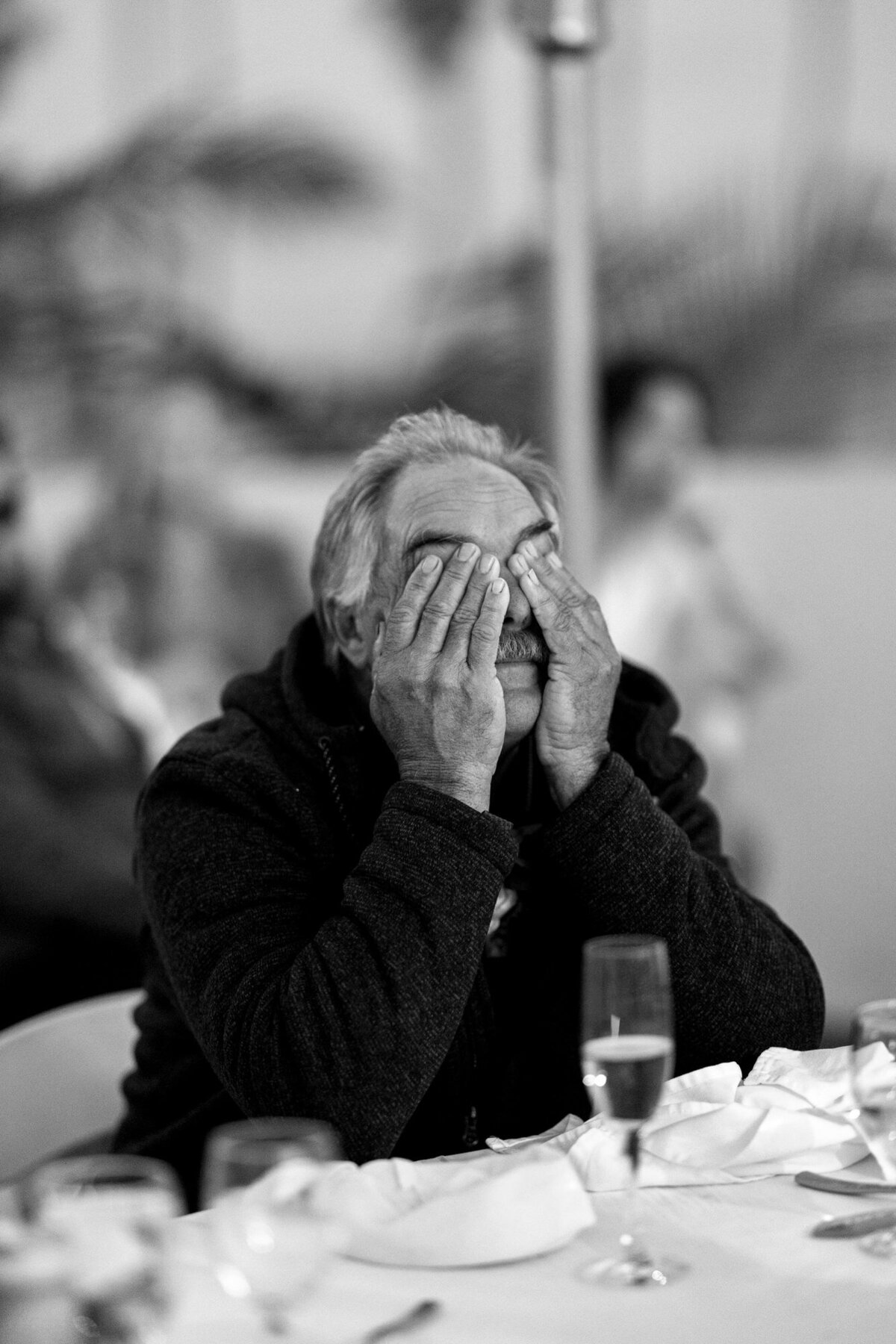 Father of bride wiping tears during maid of honor speech at Hilton Beachfront Resort Santa Barbara