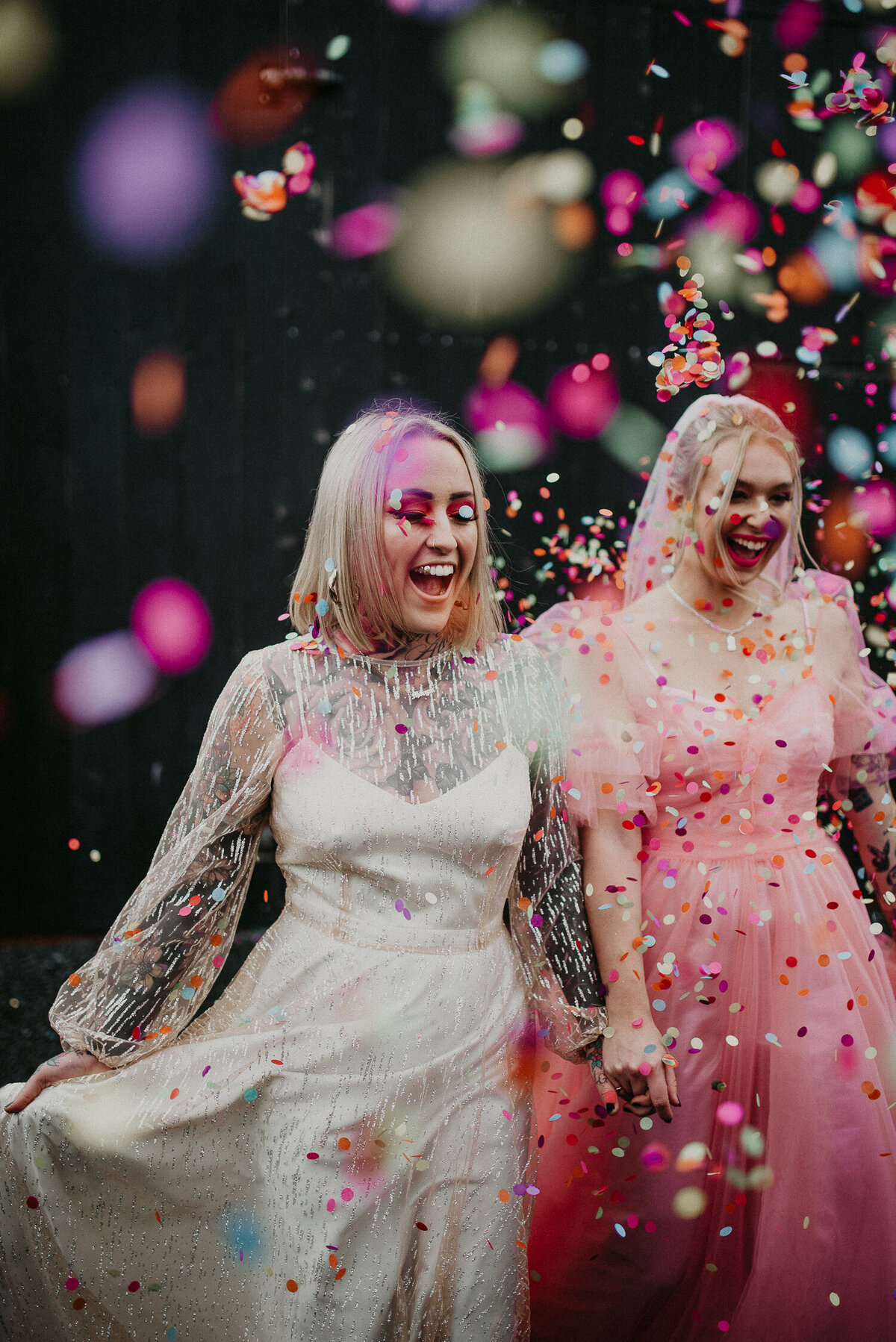 A same sex couple are showered in colourful confetti at The Giraffe Shed in Mid-Wales.