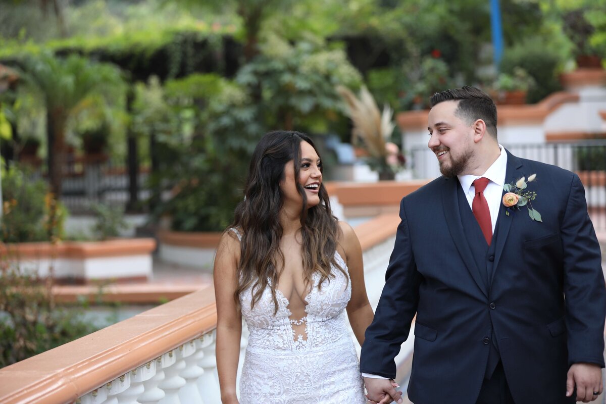 Newport Beach wedding photographer bride and groom walking together and looking at each other