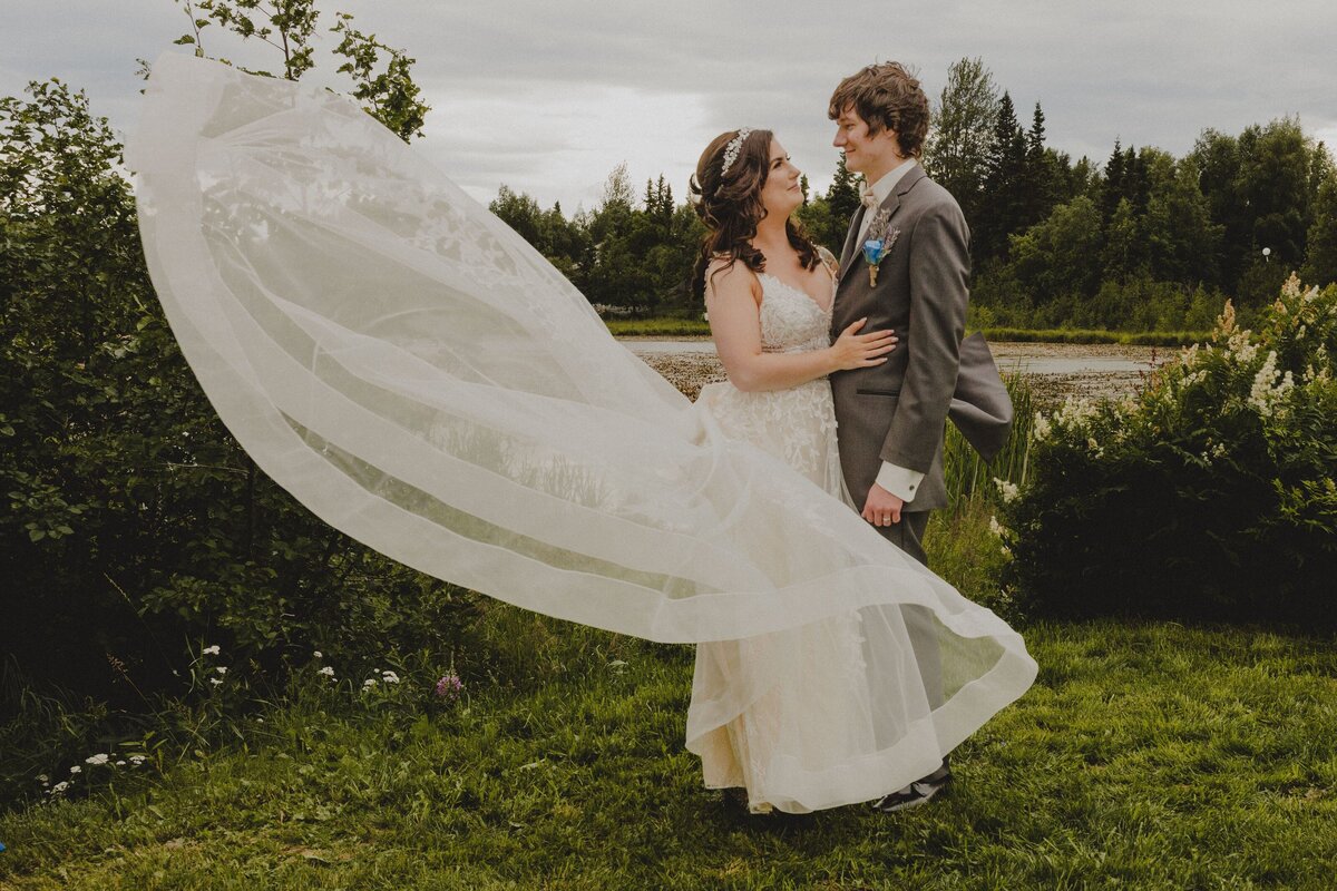 A Bride throws her dress during wedding portraits