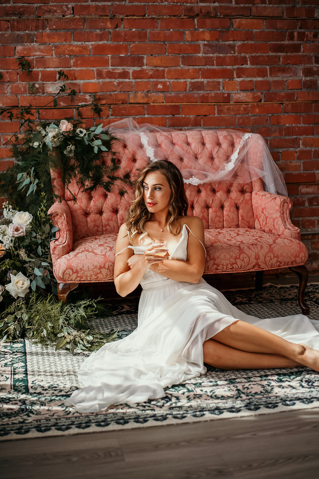 Bride sits on floor
