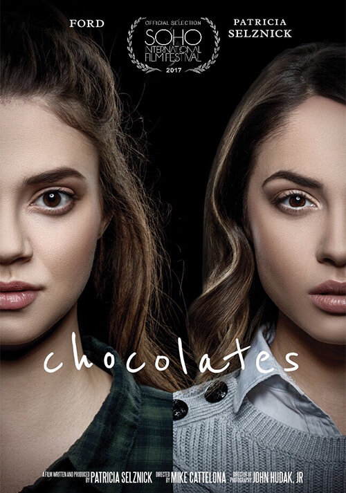 Dark and moody portrait of two models in a studio setting, showcasing intense expressions.