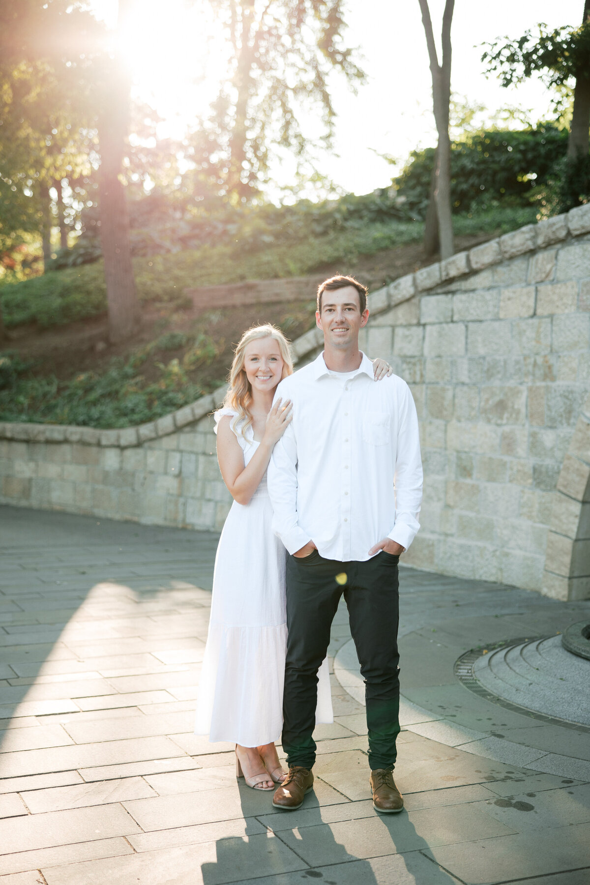 Couple poses at stone walkway during Columbus engagement shoot by Philadelphia photographer.