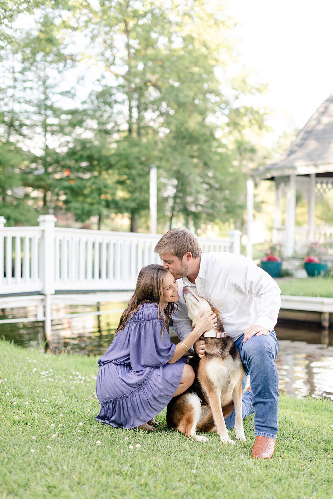 Engagement photo of couple with dog