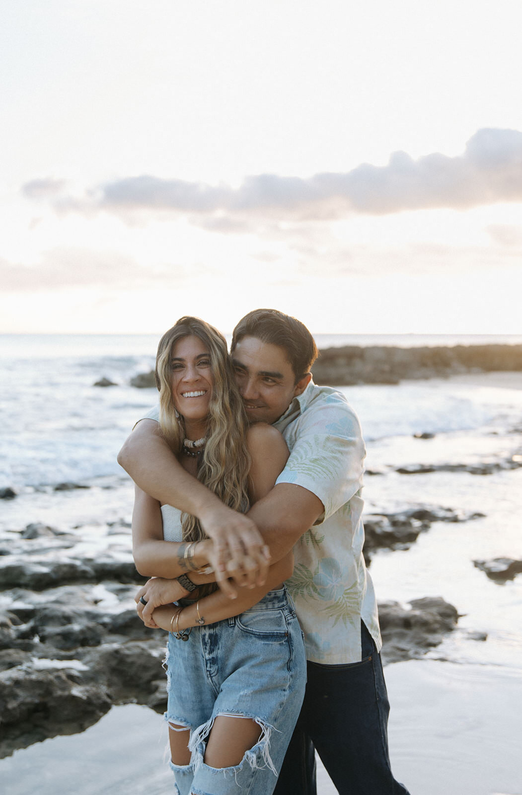 couple hugging on beach