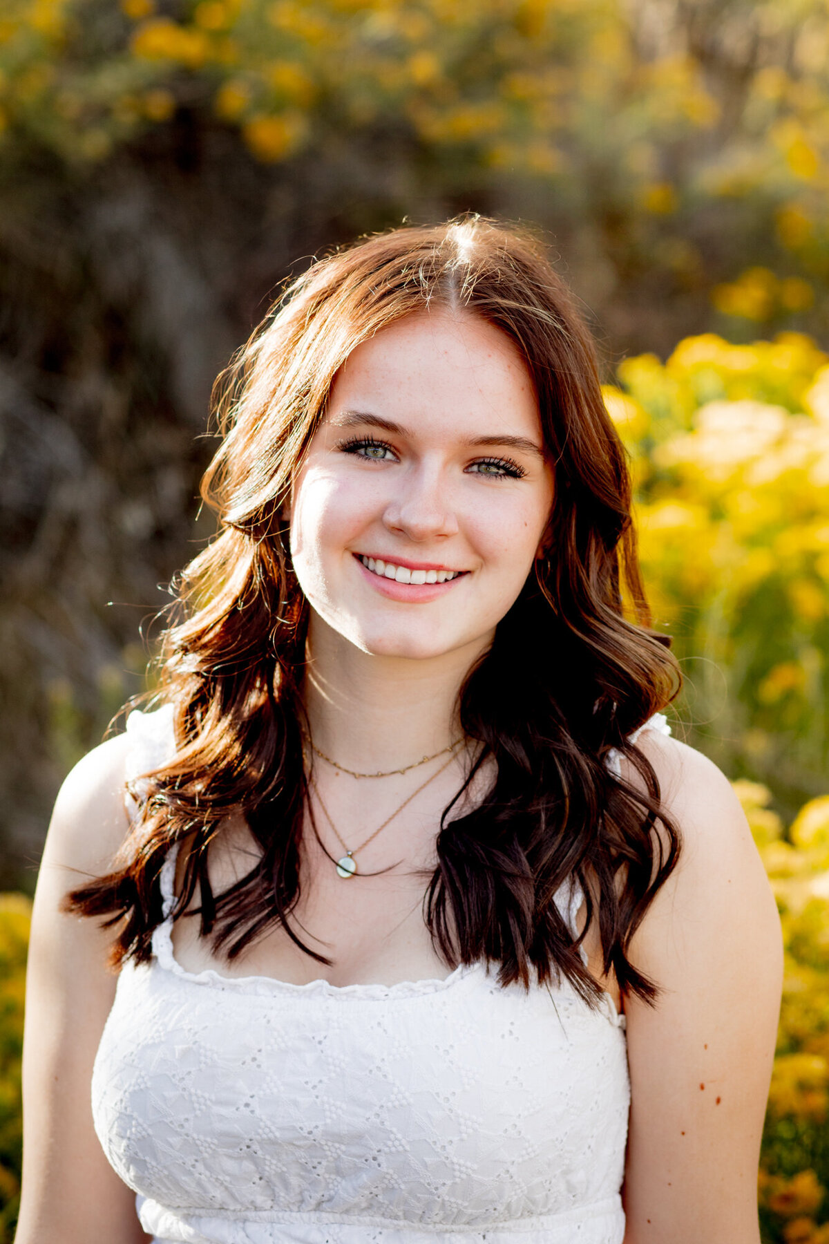 girl with green eyes smiles in professional portrait