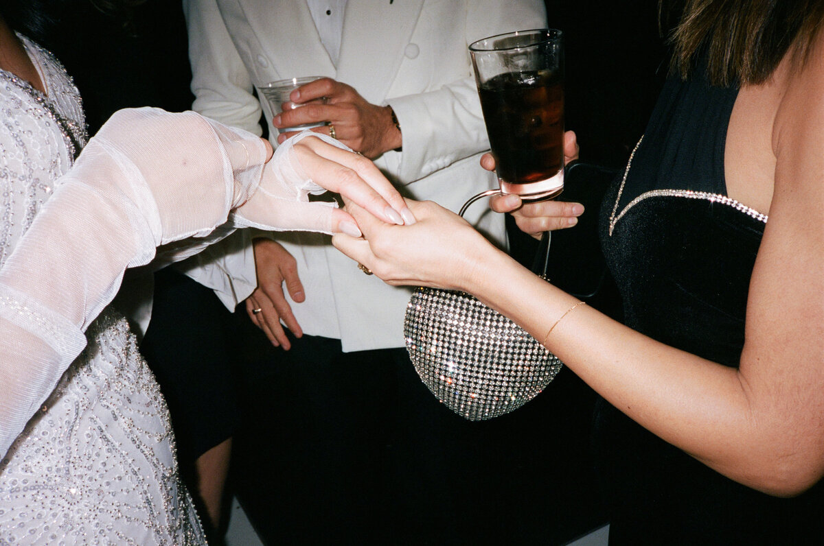 Guests admiring brides ring at The MV Skansonia in Seattle.