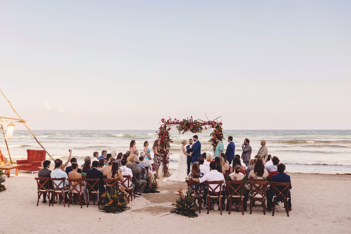 Wedding ceremony location with guest and bride and groom at Blue Venado Seaside Riviera Maya wedding