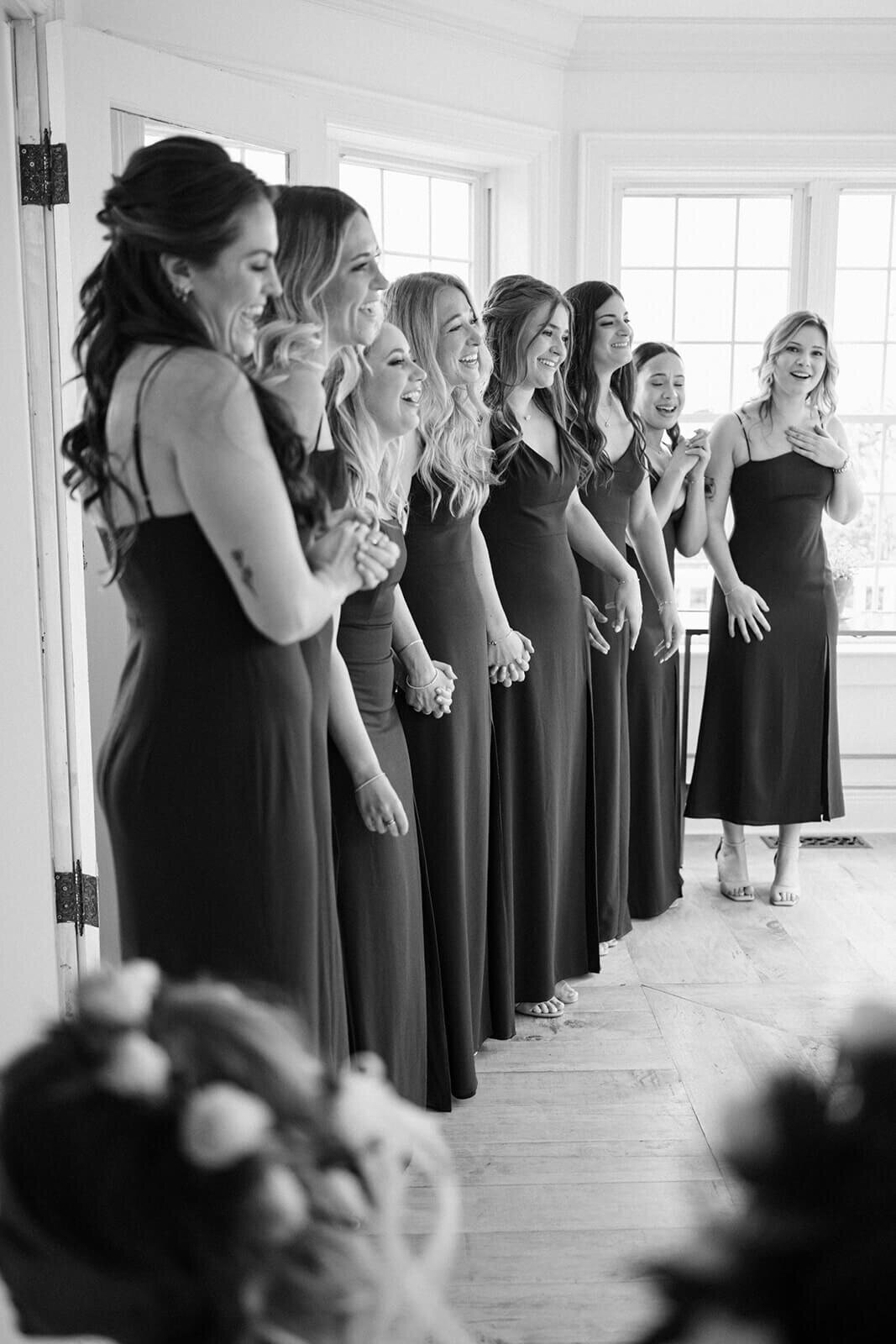 Bridesmaids lined up ready to see bride