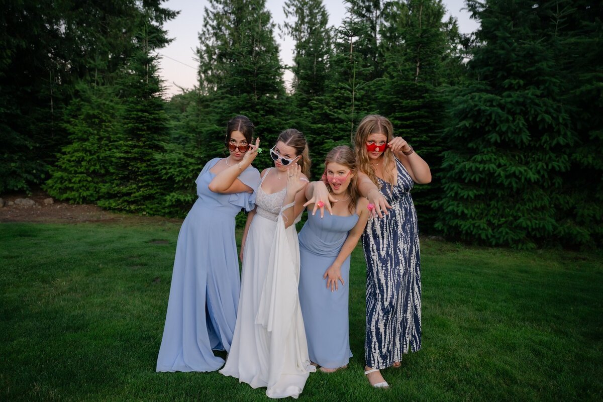 playful wedding reception photo bride with friends