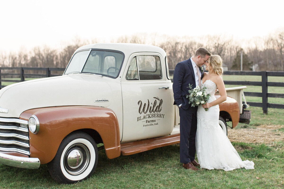 bride and groom with truck at wild blackberry farms, fortville indiana wedding