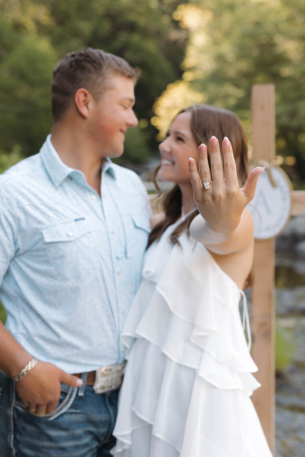 Newly engaged couple showing off the ring