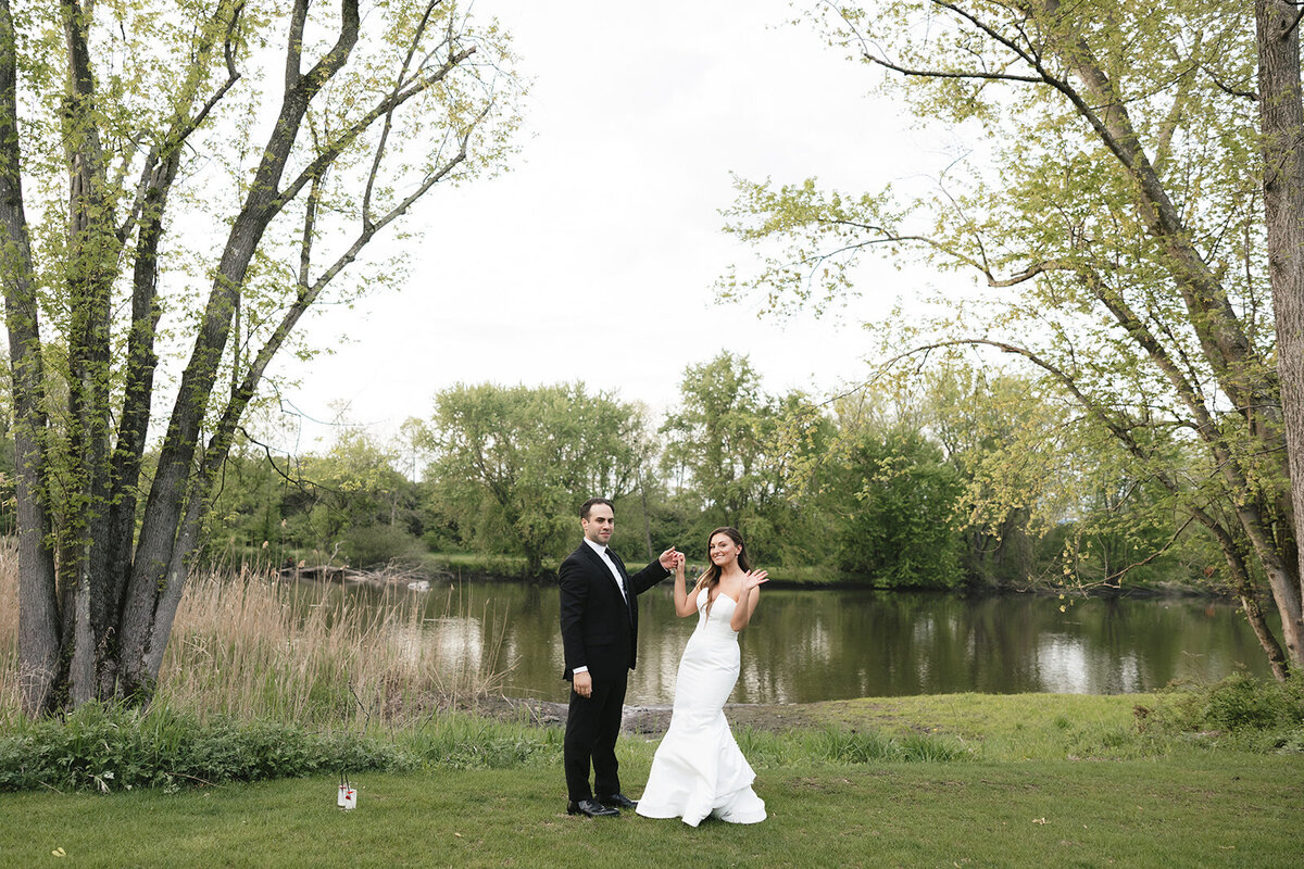 couple dancing by the river at a catskills wedding venue 