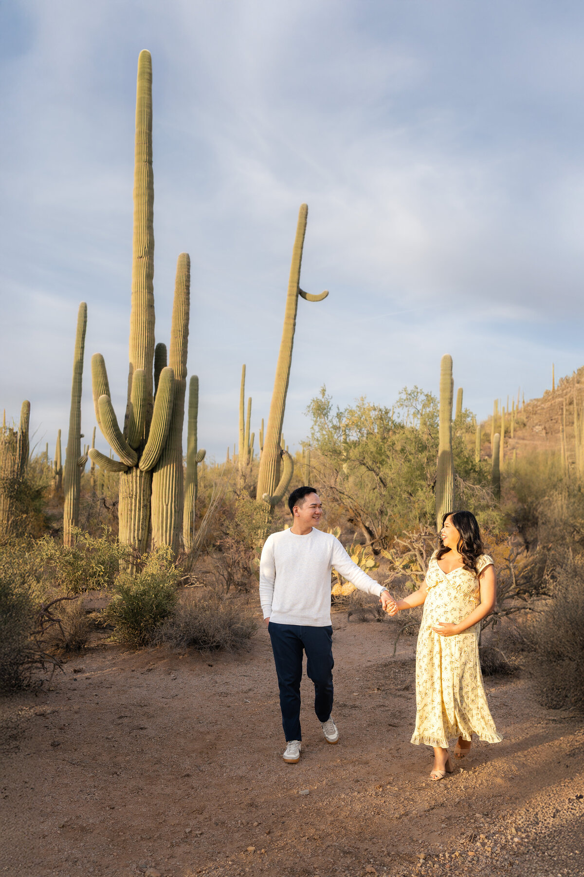 Tucson Saguaro National Park Arizona Elopement with Asian couple holding hands at sunset elopement ceremony.