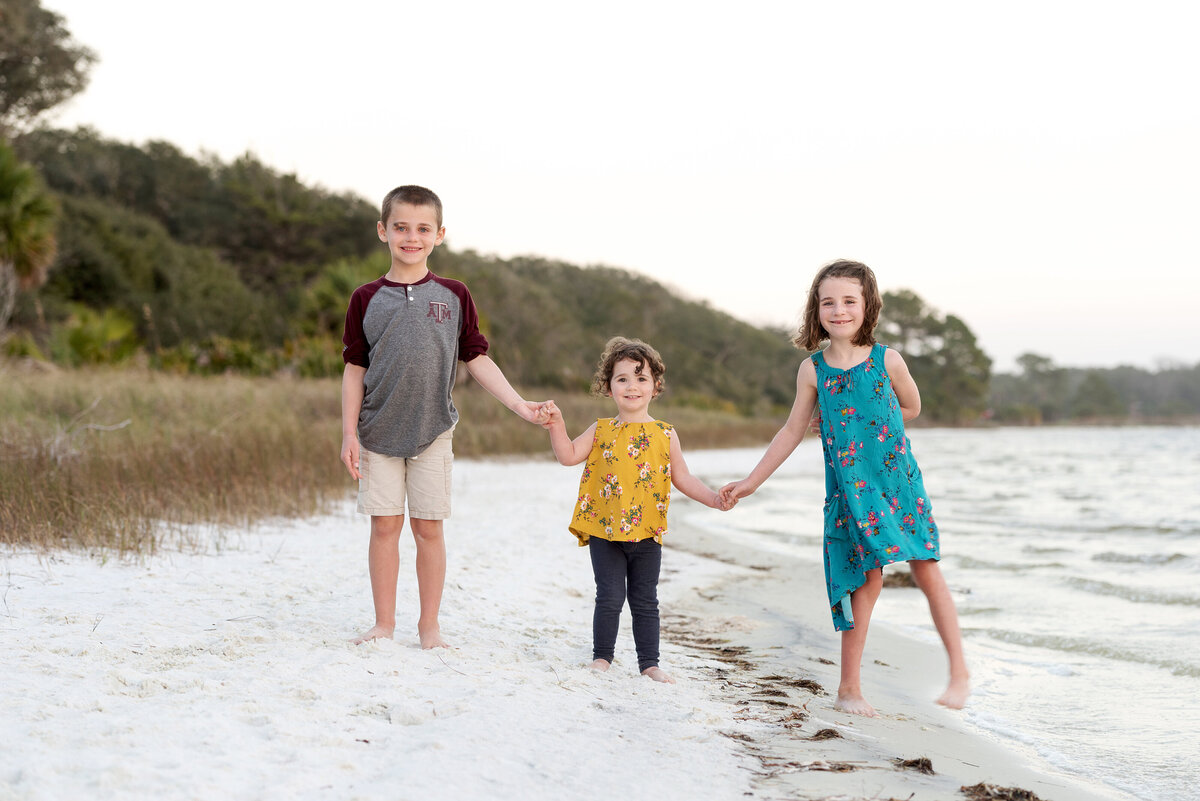 kids walking on the beach