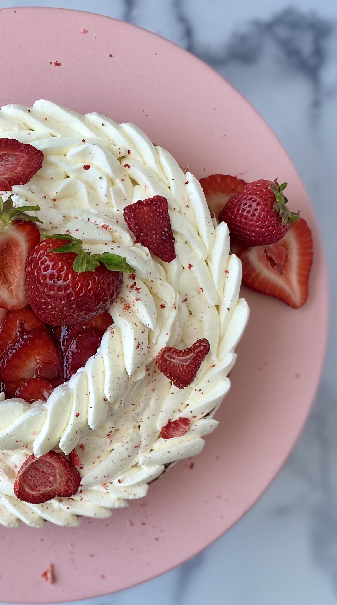 pie topped with strawberries and whipped cream