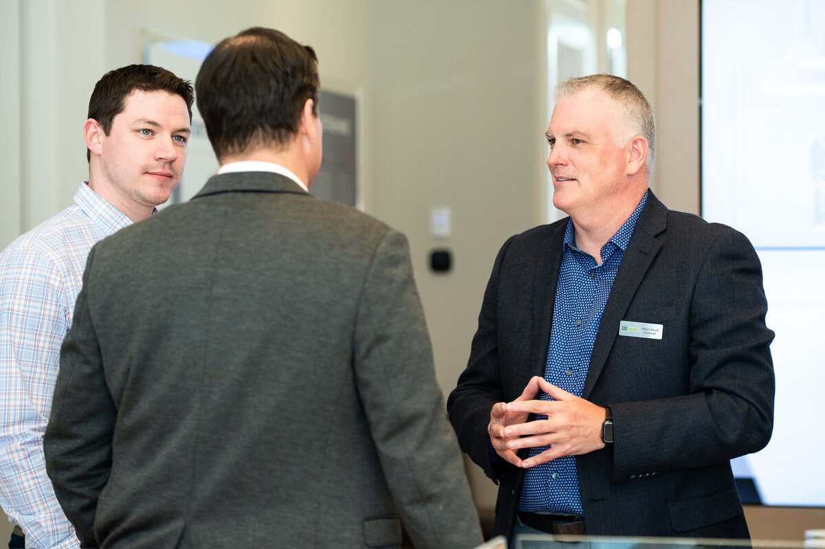 the eQ team mingling and chatting with guests during the Groundbreaking event.  the host of eQ addressing and welcoming guests to the eQ Groundbreaking event.  Captured by Ottawa Event Photographer JEMMAN Photography COMMERCIAL