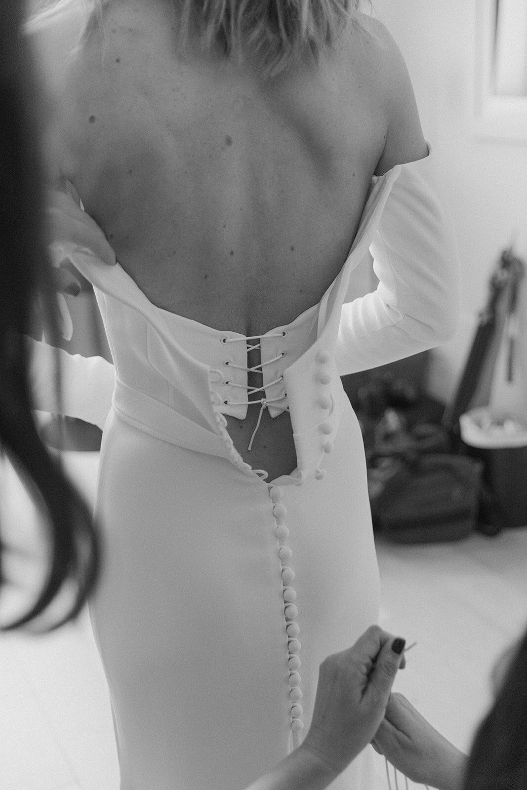 Bride getting into dress Bridemaids At Indigo Hotel in NYC